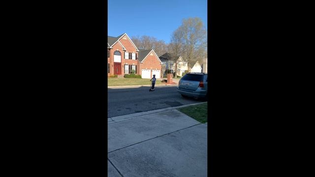 Kaiden Riding His Razor Power Core E100 Electric Scooter In The Neighborhood
