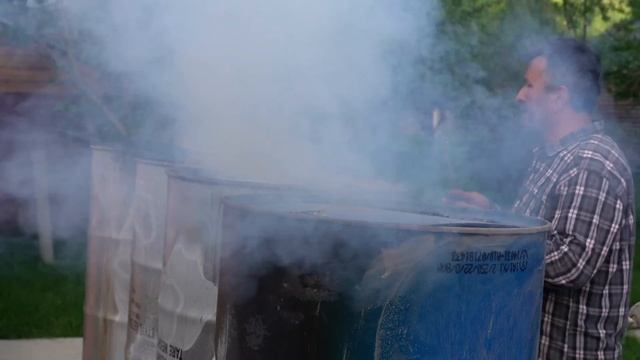 Making Barbecue Charcoal In Iron Barrels And Cooking Lamb Skewers