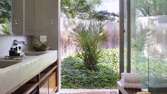 House Design Surrounded By Gardens To Provide Natural Lighting Inside The Home