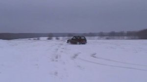 Стоковая НИВА.НИВА зимой по полю 2019. Пятаки на НИВЕ..