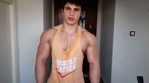 The Super muscular man flexing his biceps.