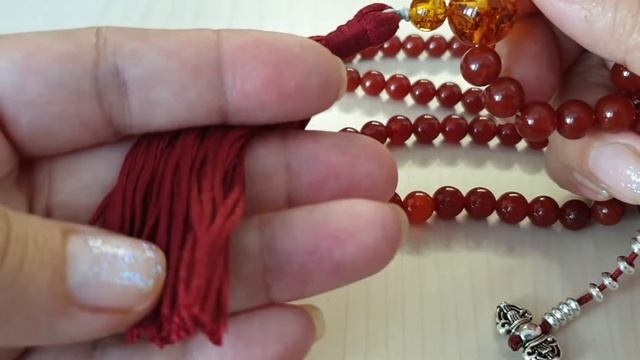 Мала 108 из сердолика и янтаря с кистью смотреть онлайн