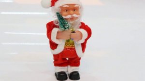 Дед Мороз музыкальный 17 см с елочкой и подарком. РЦ "Восток". Артикул 215-223.