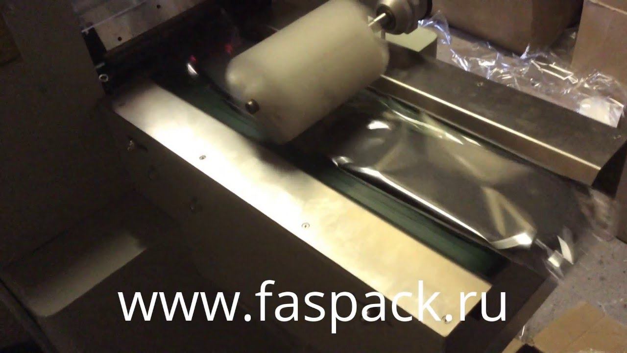 Упаковка тапок на горизонтально упаковочной машине HDL-450 (ALD-450D)