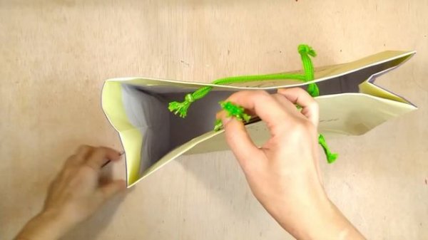 closing a gift bag with its own string/ close gift bag with handles (string with knot end )
