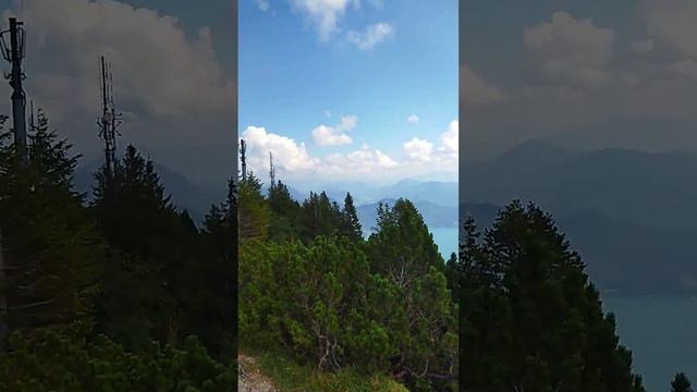 Облака в горах Вид с горы на озеро. Часовня на горе. смотреть онлайн
