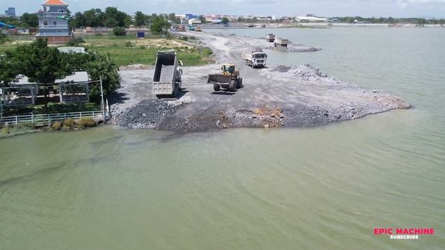 Continue with large project wheel loader is being used to push move stones to deep lake 4 New Road! смотреть онлайн