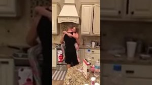 Dad Dances with Daughter in Kitchen