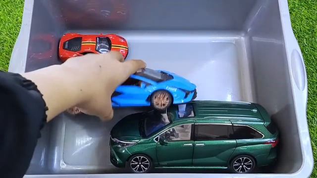 Box full of various miniature cars Maserati Subaru Ssangyong Volvo Volkswagen Audi Bentley 0