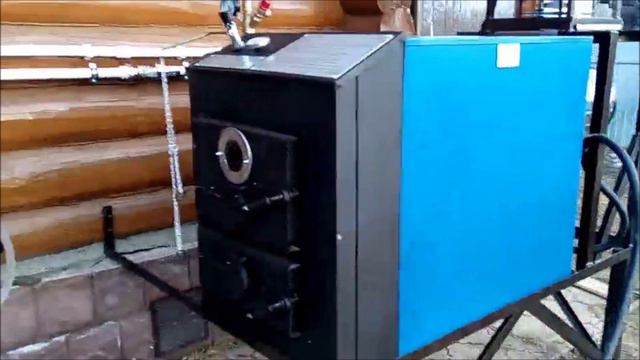 Монтаж твердотопливного котла длительного горения Космос-35 на улице смотреть онлайн