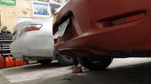 Removing the rear bumper on a 2012 Nissan Leaf to change the license plate.