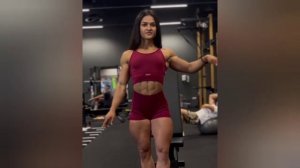 Gorgeous muscular woman flexing biceps