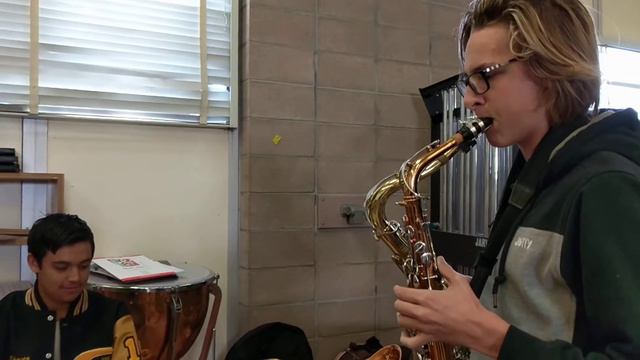 Kid plays alto and tenor at the same time, for the first time. смотреть онлайн