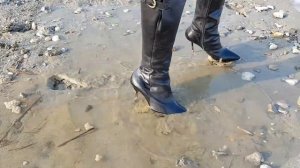 Buffalo high heel boots in mud