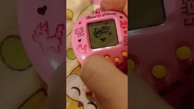 рассказываю как играть в Тамагучи смотреть онлайн