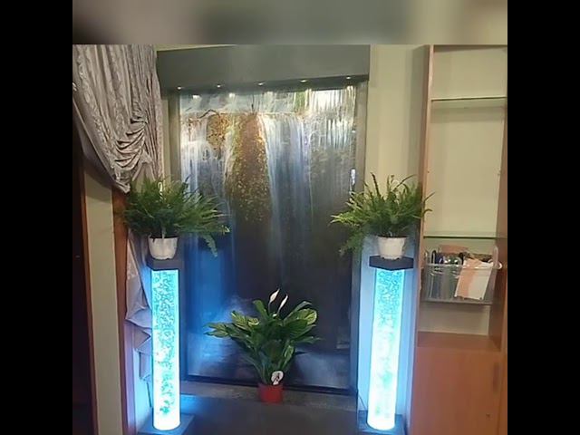 Подставки под цветы из пузырьковых колонн на фоне водопада по стеклу от ООО Аква-Дрим смотреть онлайн
