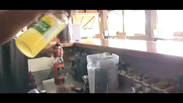 Mixing up a Kirani James cocktail at Umbrellas Grenada смотреть онлайн