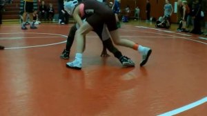 Little girl youth wrestler pins with inside cradle and outside cradle techniques in wrestling match