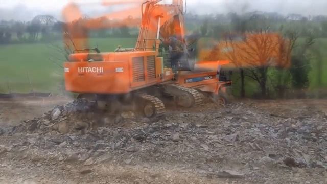 Hitachi excavator digging on a road construction site смотреть онлайн