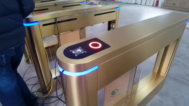 Golden automatic ticket barrier gate NFC reading for theme park ticketing system. смотреть онлайн