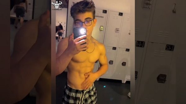 14 years old teen boy flexing muscle