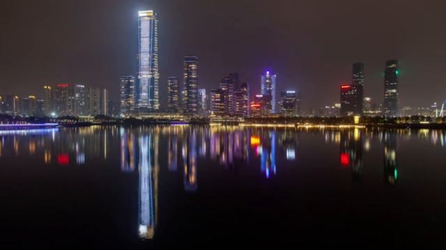 Shenzhen convention center at night, illuminated buildings and traffic, Fast traffic and skyscrape смотреть онлайн