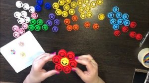 Конструирование из крышек от детского пюре.