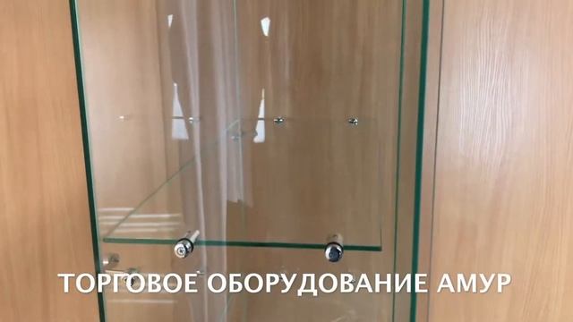 Стеклянная витрина с белым накопителем. Купить витрины для магазина. Заказать витрины. смотреть онлайн