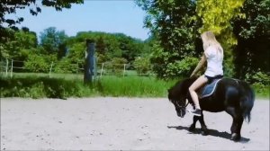 girl in shorts ride pony