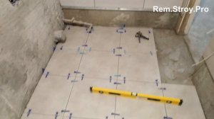 Укладка плитки на пол в ванной комнате