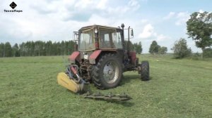 Беларус ТТР-401М косит пастбище роторной косилкой