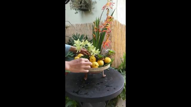 Asymmetrical centerpiece using cymbidium orchid and exotic crocosmia. смотреть онлайн
