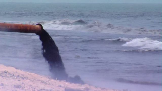 Raw sewage pouring into the ocean and beach. Human pollution stock footage смотреть онлайн
