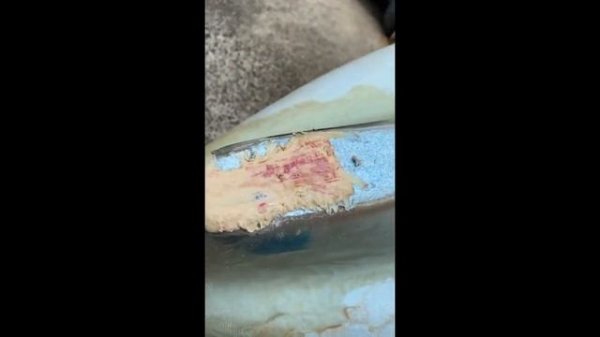 ocean kayak drifter repairing a kayak hdpe , sanding filling Oahu Hawaii. Is stipple a word?