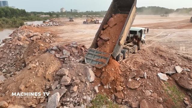 Huge Land Reclamation Process Dump Truck Management Unloading Rock Dirt Bulldozer Pushing Stone смотреть онлайн