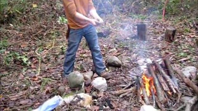 Making a fire with wet wood during survival training weekend смотреть онлайн