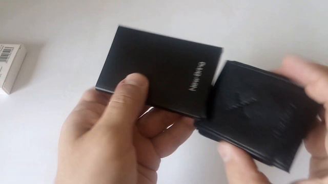 Шикарный металлический картхолдер в чехле с механизированной подачей карт от New-Bring. смотреть онлайн