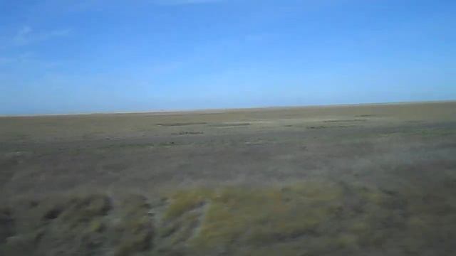 Уборка хлеба и вспашка земли на полях Кустанайской обл. из окна "Тальго" смотреть онлайн