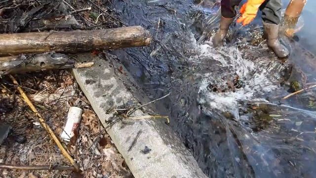 Clearing A Massive Clog On A Lake Drain Culvert