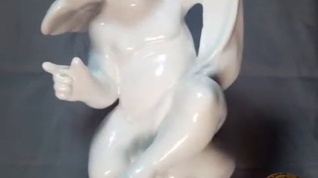 Elegant White Porcelain Figurine Depicting A Cherub Angel. Period: Art Deco