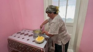 Woman lives alone on the top of a mountain. Cooking a traditional Carpathian dinner