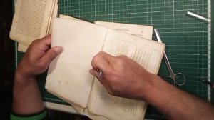 Реставрация книг дома. Книга с составным форзацем, кожаным корешком и тканевым покрытием переплета.