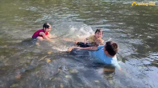 Bibi experienced swimming in the river while camping