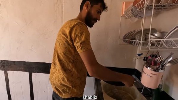 "Nomadic Family Bonds Through Stone Wall Construction"