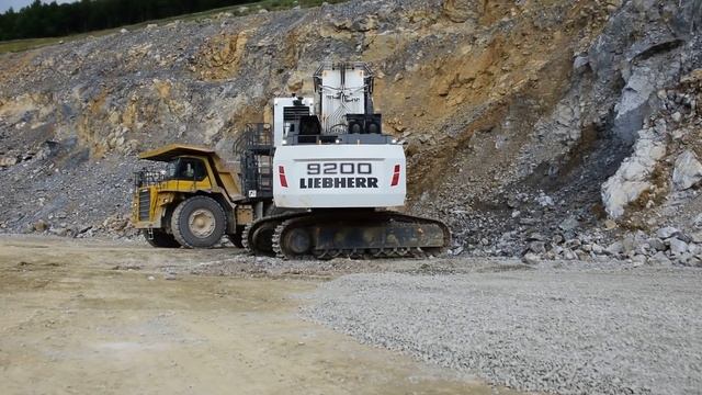 Liebherr R9200 Front Shovel Loads Komatsu HD 785 Dumptruck