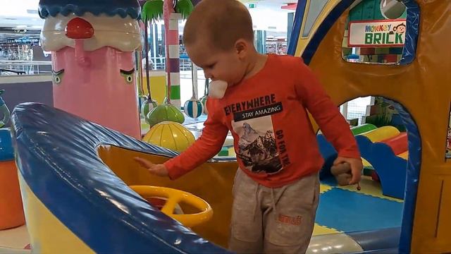 A child plays on the playground with his mother building a wall of bricks смотреть онлайн