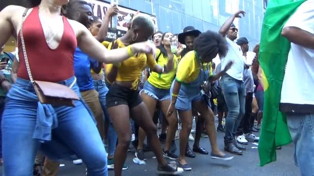BRAZILIAN GIRLS DANCE AT BRAZILIAN CARNIVAL TO SAMBA CARNIVAL DRUMS ORCHESTRA MUSIC NEW YORK CITY