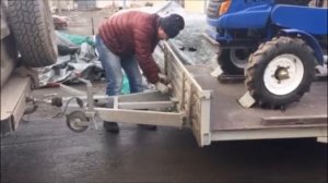 Перевозка минитрактора в автомобильном прицепе