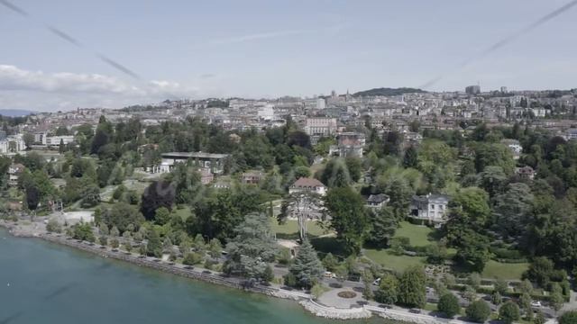 Lausanne, Switzerland - July 13, 2019: Olympic Museum. The coast of Lake Geneva., Aerial View смотреть онлайн