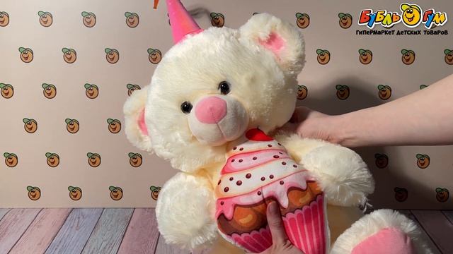 Игрушка мягкая медведь белый с колпаком и кексом розовым 61см